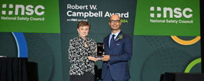Lorraine and Chuck holding the Campbell Safety Award