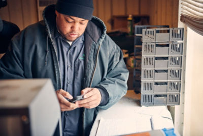 Man at counter on phone