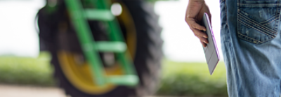 Man with Ipad in foreground