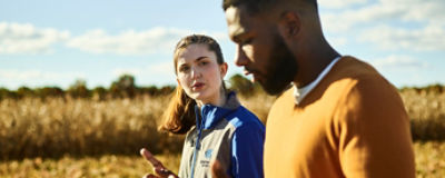 man and woman in crop field