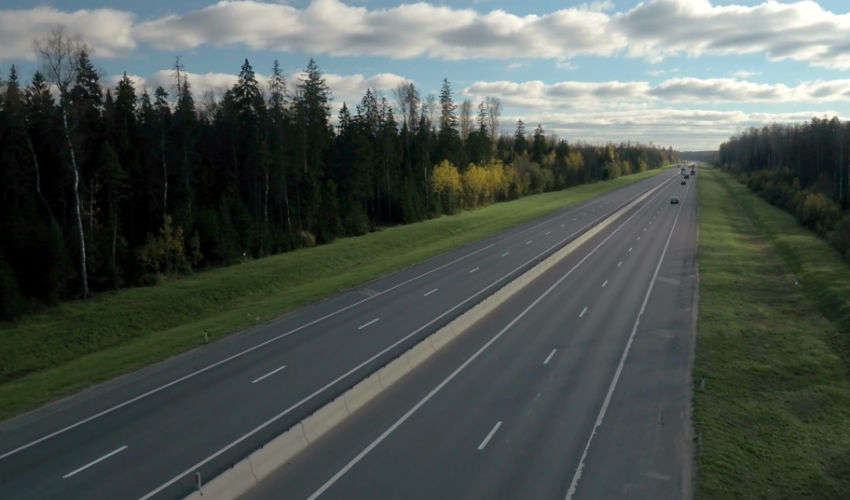 Two lane highway with trees on each side