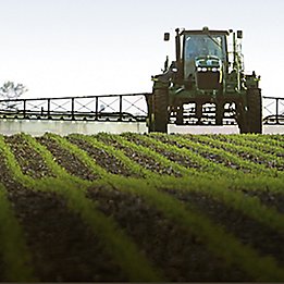 Image of soybean field with application tractor