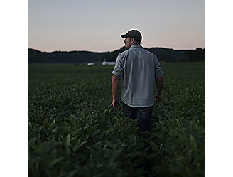 Farmer walking through field