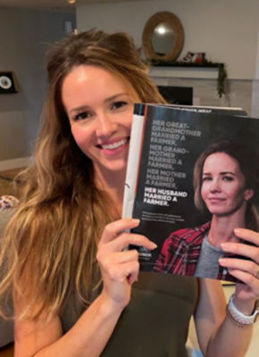 A woman farmer who is smiling, to convey how Corteva supports women in farming.