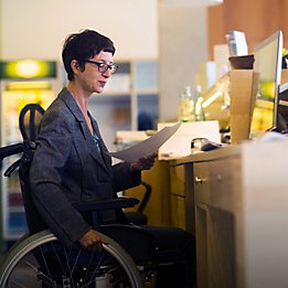 Woman in wheelchair at computer