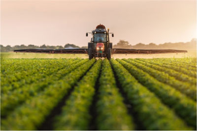 sprayer in soybean field