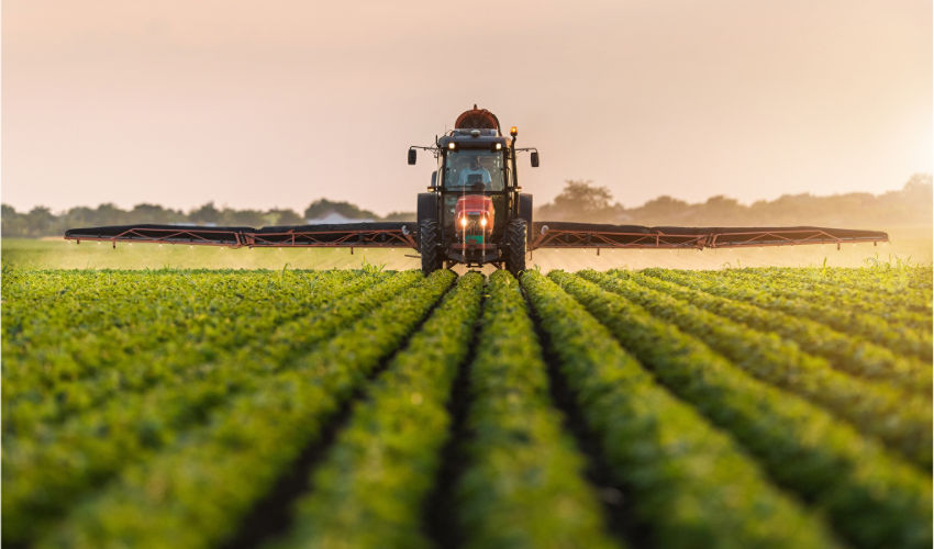 sprayer in soybean field