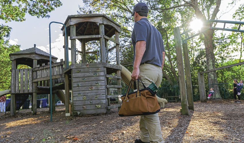 Certified Sentricon Specialist at a wooden playground
