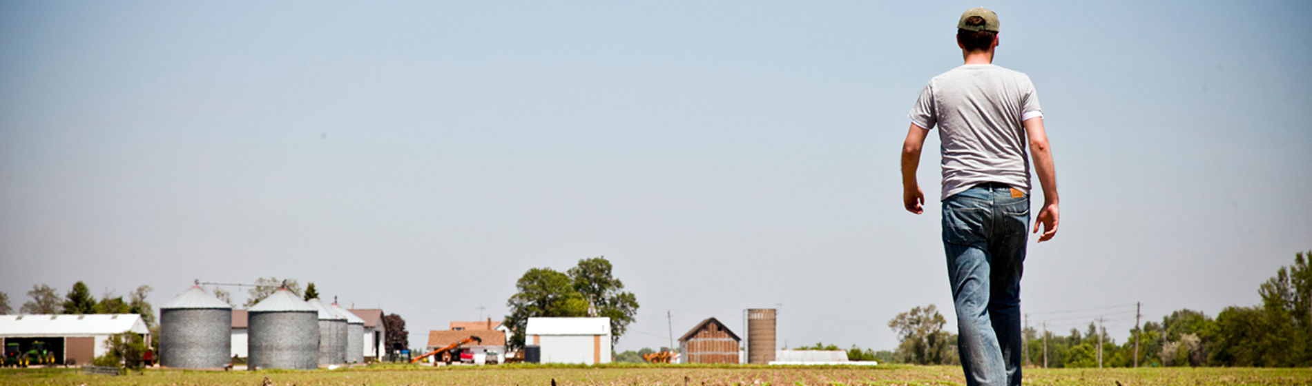 Farmer walking towards farm