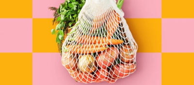 A bag of assorted vegetables hanging.