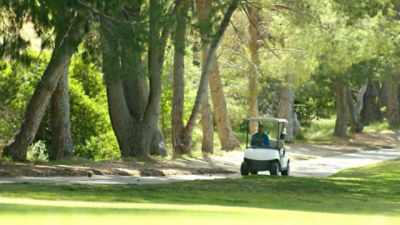 golf course super in a cart
