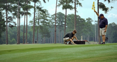 Two golf superintendents on the golf course