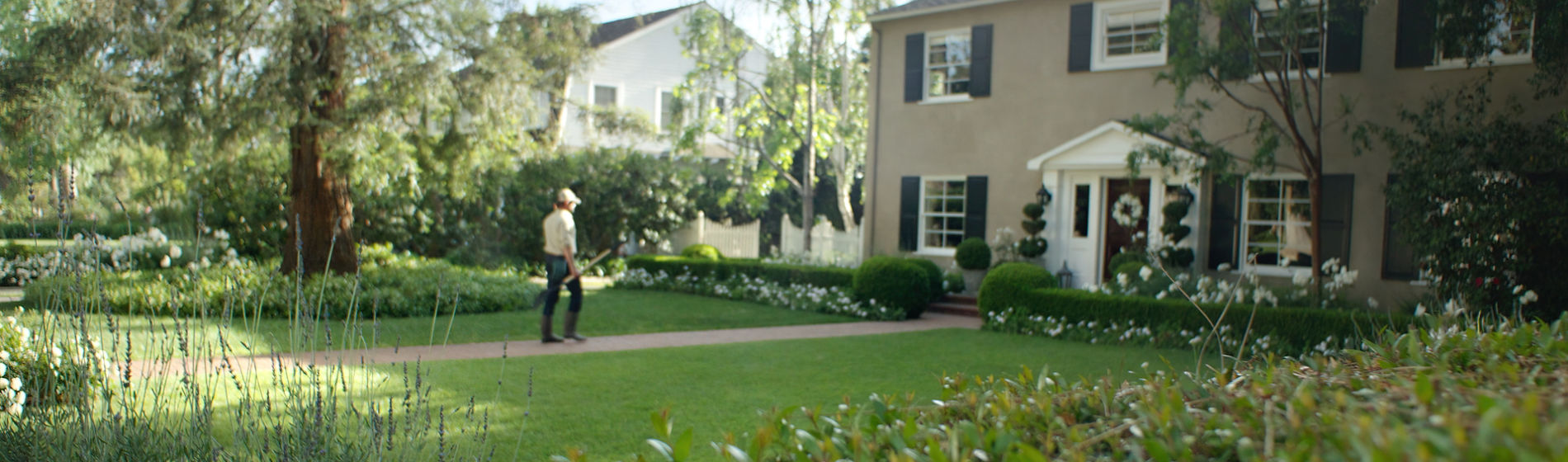 Lawncare person maintaining yard 