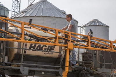 Farmer loading sprayer