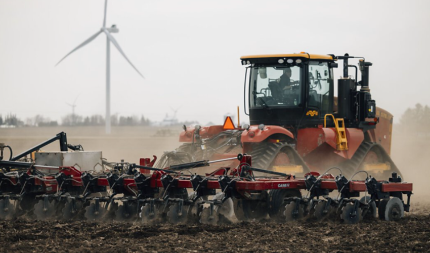 Red tractor discing