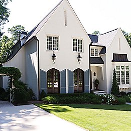 Image of stucco house driveway and lawn