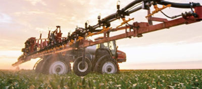 sprayer in soybean field