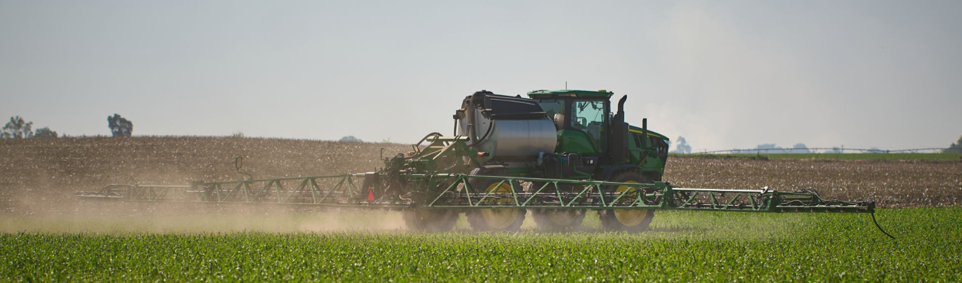Sprayer making application in corn field