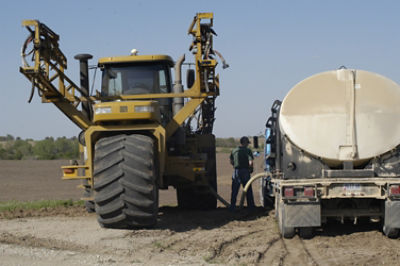 Tanker filling sprayer with herbicide