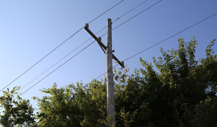 Telephone pole, sunrise