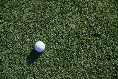white golf ball on green