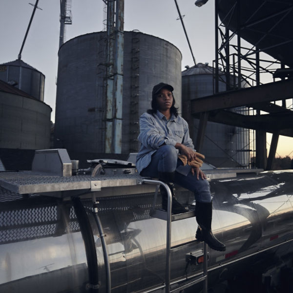 Woman in front of silos