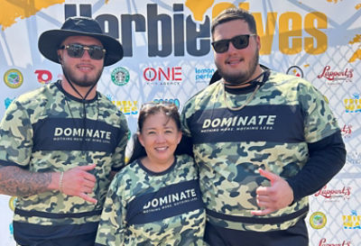 photo of two men and a woman in the Herbiegives event