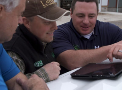 Lawnel family looking at tablet