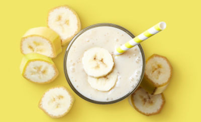 Banana Milkshake on Yellow Background