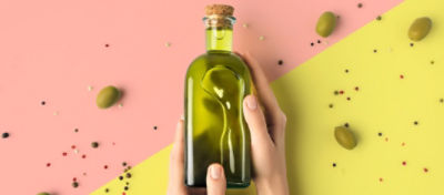 bottle-of-olive-oil-in-hands