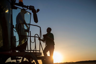 Men talking on tractor