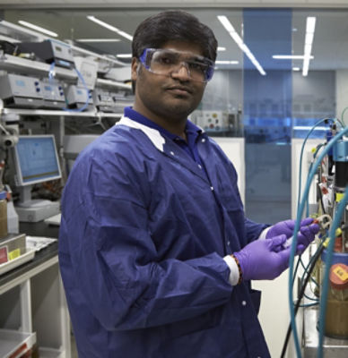 man in lab wearing protective eyewear