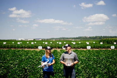 man and woman in crop field