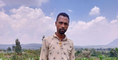 Ashebir Gebre in the farm
