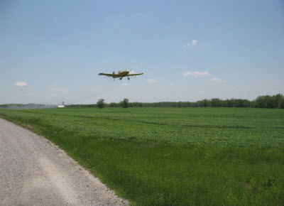 Aerial application of foliar fungicide to wheat field in Missouri.