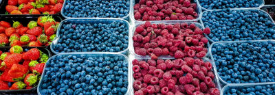 display of strawberries, blueberries, and raspberries