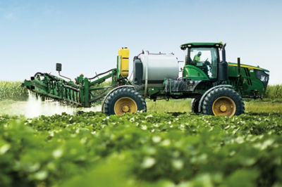 Image of a cotton field with herbicide being applied.