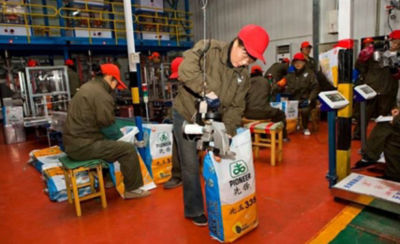 Chinese Pioneer workers in factory