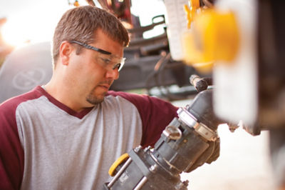 Image of man filling tank with Enlist One®