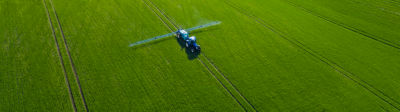 Image of tractor spraying field