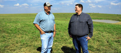 Two men observing a range