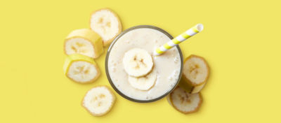 Banana Milkshake on Yellow Background