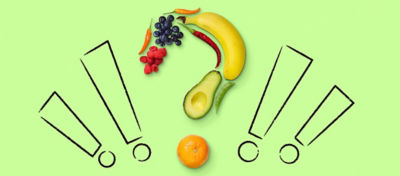 Question mark made of various fruits with four exclamation marks surrounding the fruit question mark.