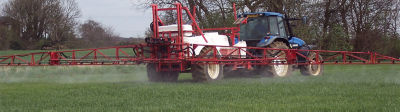 sprayer in wheat field
