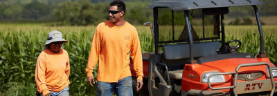 Man and Woman Farmers among Crops