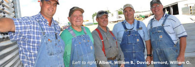 five men from Kentucky’s Peterson Farms standing side by side wearing overalls